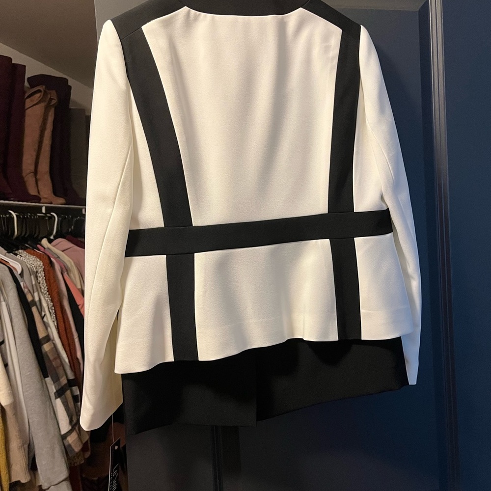 Womens work suit . Jacket and skirt. never worn